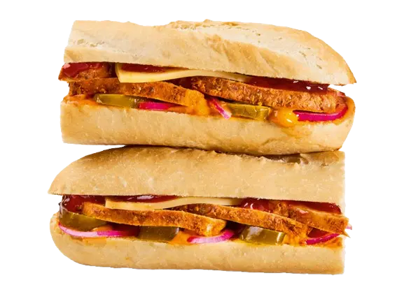 Greggs Menu And Updated Prices In UK 2025 149 Greggs Spicy Chipotle Chicken Baguette filled with grilled chicken breast, chipotle sauce, salad, and mayonnaise in a crispy white baguette, served as a hot and spicy meal option.