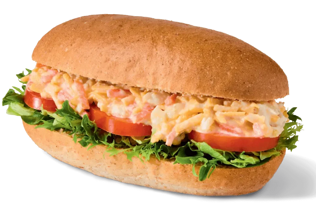 Greggs Menu And Updated Prices In UK 2025 158 Greggs Cheese & Onion Roll is a sandwich with cheese, onion, and carrot in mayo and salad cream, topped with tomato and mixed leaf salad.