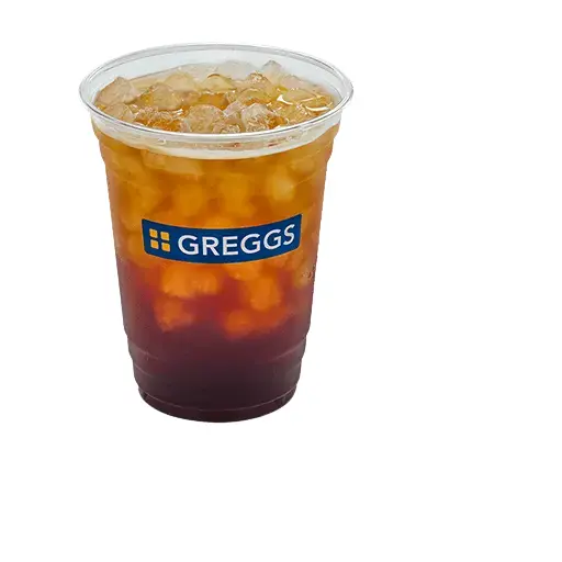 Greggs Menu And Updated Prices In UK 2025 65 A tall glass of iced Americano with dark espresso over ice, showing a rich brown color and condensation on the glass for a refreshing look.
