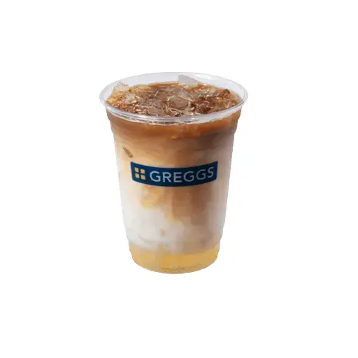 Greggs Menu And Updated Prices In UK 2025 63 A chilled iced salted caramel latte with ice cubes, caramel swirls mixing into the milk and espresso, topped with a glossy drizzle of caramel.